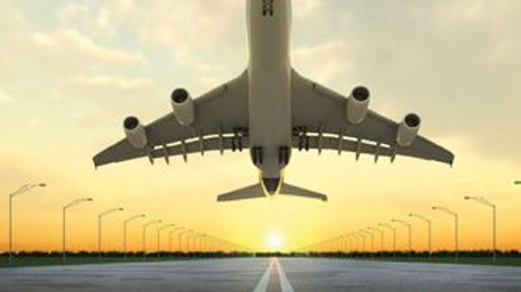 takeoff plane in airport at sunset