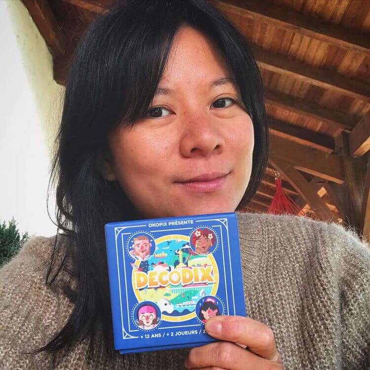 Céline Aho-Nienne est la co-fondatrice de la maison d'édition Okopix, qui a créé et édite le jeu de carte Décodix.