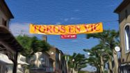 Photo d'une banderole suspendue entre deux maisons avec l'inscription "Toros en Vic"